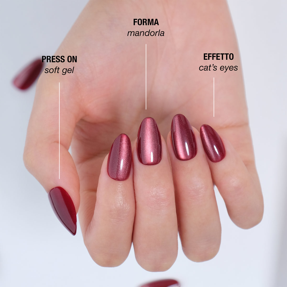 Dettaglio della manicure Berry Cat's Eyes in soft gel, forma mandorla, effetto cat's eyes